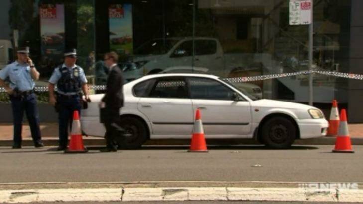 Police allege the man smashed a car's window with his axe. Photo: Nine News