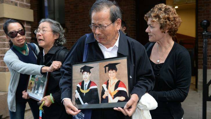 Devastated: Relatives of victims allegedly murdered by Robert Xie express their grief after giving evidence in May. Photo: Dean Lewins (AAP)