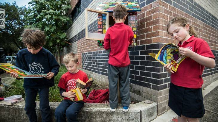 Students from Australia Street Infant School taking books from their Street Library. Photo: Wolter Peeters
