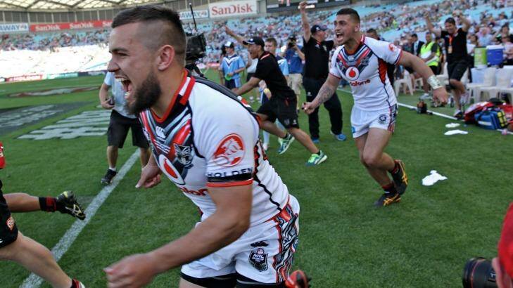 That's settled: Warriors players let off steam after beating the Broncos. Photo: Brendan Esposito