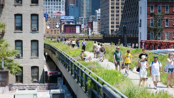 People walk the New York High Line, an elevated park along 10th Avenue. Photo: iStock