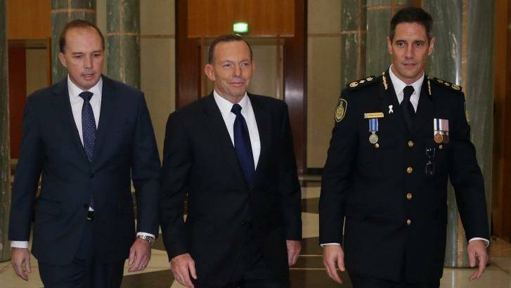 Prime Minister Tony Abbott attended the swearing in ceremony of the inaugural Border Force Commissioner Roman Quaedvlieg with Immigration minister Peter Dutton at Parliament House. Photo: Andrew Meares
