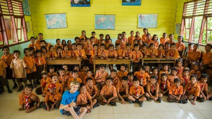 Winter Vincent with kids from Sarasau primary school, Siberut, Mentawai Islands. Photo: Rodd Owen