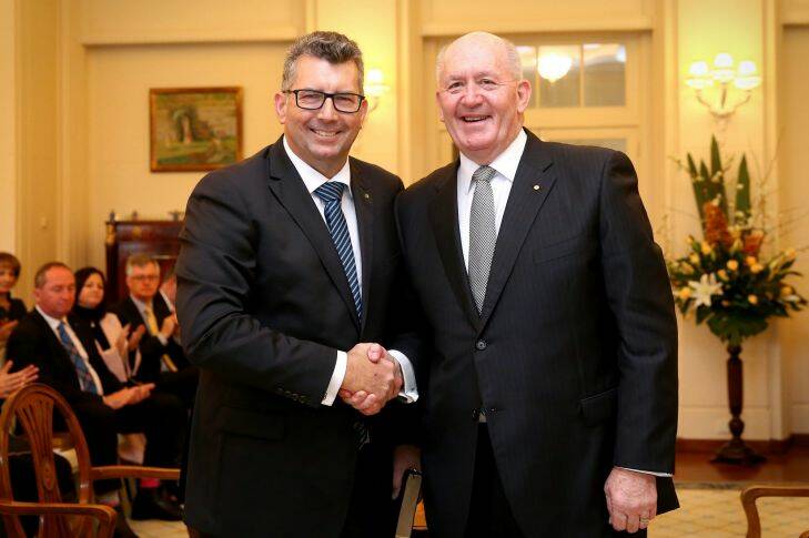 Assistant Minister for Trade, Investment and Tourism Keith Pitt and Governor-General Sir Peter Cosgrove during the swearing-in ceremony at Government House in Canberra on Tuesday 19 July 2016. Photo: Alex Ellinghausen