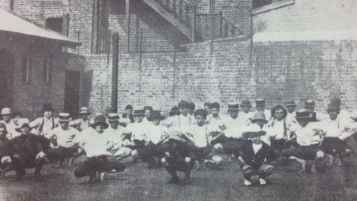 Boys exercising in the yard of the Metropolitan Boys' Shelter, part of the Albion Street Children's Court, in 1913. Photo: Supplied