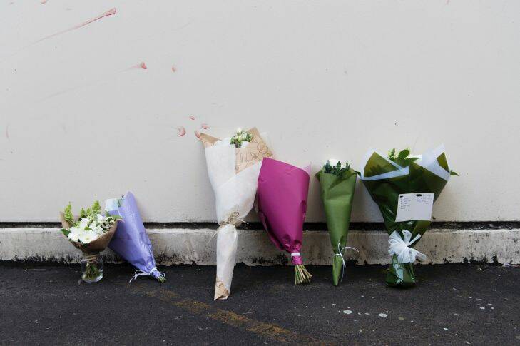 Flowers left at the scene of the crime in memory of Hee Kyung Choi in an alley off Brown Street, Chatswood. Hee Kyung Choi fell to her death after an argument with her boyfriend June Oh Seo, yesterday morning. Photographed Tuesday 10th October 2017. Photograph by James Brickwood. SMH NEWS 171010