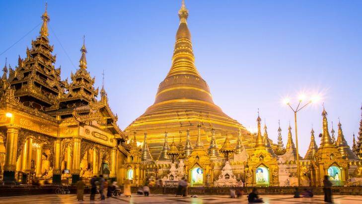 Famous Shwedagon golden pagoda at dusk.
