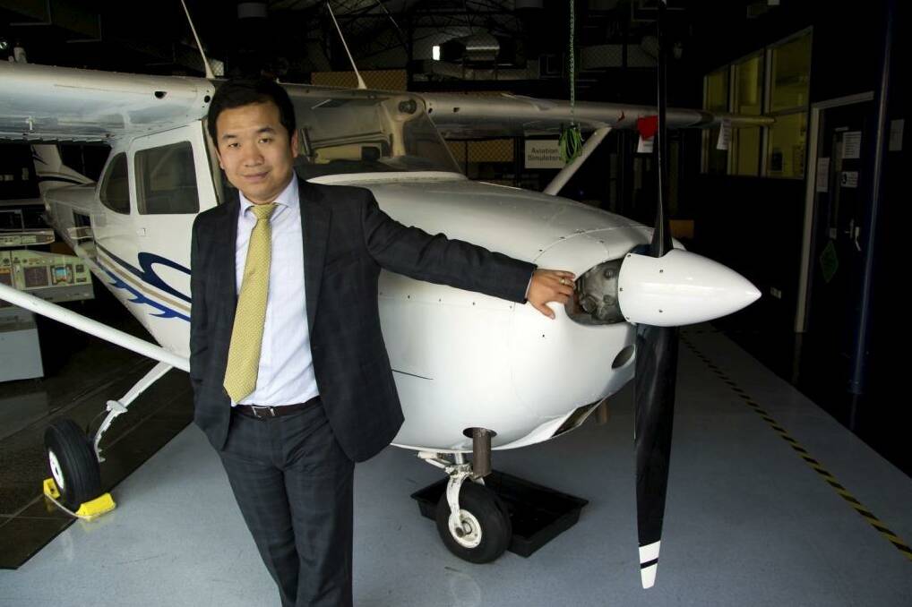 Yi Gao lectures the next generation of aviation professionals at Swinburne University of Technology. Photo: Fairfax