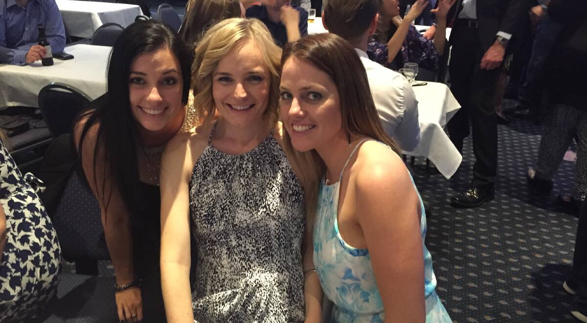 MIRACLE: Former Tamworth woman Kate McDonald (centre) continues her against-the-odds recovery from a horrific spinal injury. Katrina Oxm, left, and Natalie Woo were among about 600 people to turn out in support of Ms McDonald at a fundraiser in Tamworth on Saturday night.