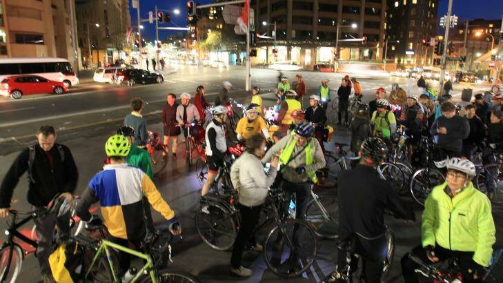Cyclists protesting the state government's plans to rip up a cycleway on College Street. Photo: James Alcock