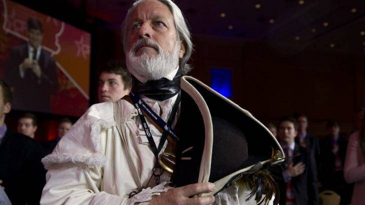 William Temple from the Golden Isles Tea Party, dressed as Declaration of Independence signer Button Gwinnett, holds his hat during the Pledge of Allegiance at the Conservative Political Action Conference in National Harbor, Maryland, US.  Photo: Andrew Harrer