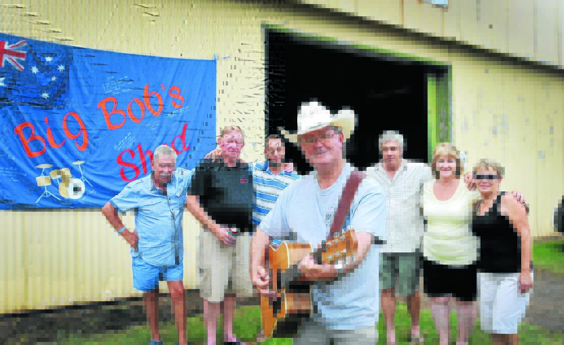DIGGING DEEP: Locals, campers and friends of a Victorian family who had their car stolen and torched banded together to raise money to help them get home. Pictured are, back from left, Adrian Gray, Paul Fitzpatrick, Brad Howarth, Geoff McClure, Col Milligan, Donna McClure and Marion Brauman. Photo: Geoff O Neill 230115GOA01