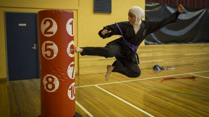 One of Ashleigh's photos to be exhibited as part of Seeing Summer: 17-year-old Saleha Amin from South Granville High taking part in a tae kwon do practice run by Master Ridvan in Auburn.  Photo: Conor Ashleigh
