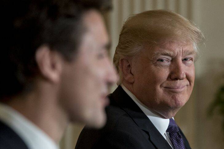 U.S. President Donald Trump smiles as Justin Trudeau, Canada's prime minister, left, speaks during a news conference in the East Room of the White House in Washington, D.C., U.S., on Monday, Feb. 13, 2017. Amid talk in the U.S. of resetting trade relationships, Trump and Trudeau said both countries are committed to maintaining trade ties and economic integration that support millions of jobs on both sides of the border. Photographer: Andrew Harrer/Bloomberg via Getty Images All the people charmed by Justin Trudeau Photo: Bloomberg