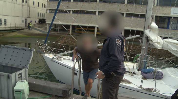 Hamish Thompson is arrested by police after they allegedly seized 1.4 tonnes of cocaine from the yacht Elakha. Photo: Australian Federal Police