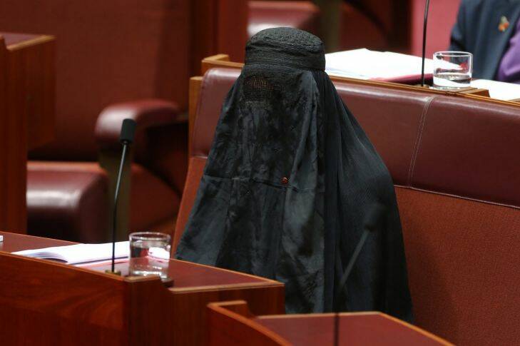Senator Pauline Hanson wearing a burqa, during Question Time at Parliament House in Canberra on Thursday 17 August 2017. fedpol Photo: Alex Ellinghausen