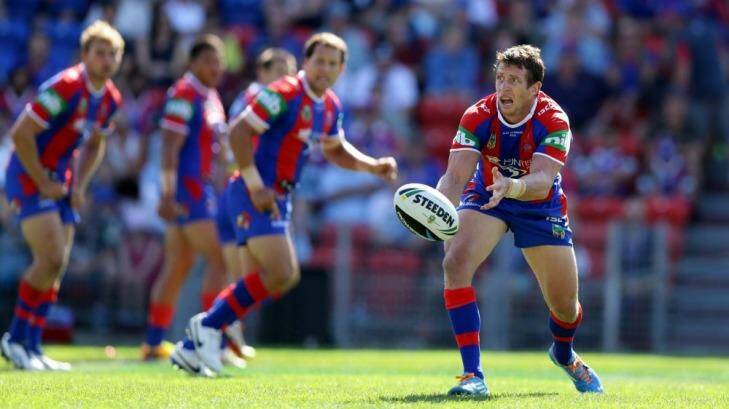 Playing for Alex: Knights captain Kurt Gidley gets a pass away against the Sharks. Photo: Jonathan Carroll