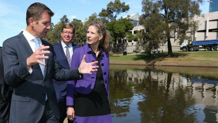 NSW Premier Mike Baird (left), Deputy Premier Troy Grant and newly appointed Powerhouse director Dolla Merrillees walking along Parramatta River across from the proposed museum site. Photo: Louise Kennerley