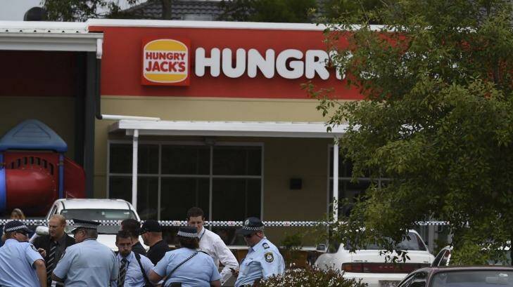 Police outside Hungry Jack's at West Hoxton where a teenage girl has died. Photo: Brendan Esposito