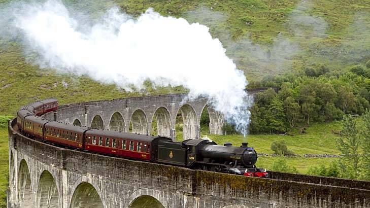 The Jacobite steam train crosses the Glenfinnan Viaduct at the head of Loch Shiel. Photo: VisitScotland/ScottishViewpoint