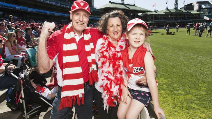 Sydney Swans fans Peter Thomas, his wife Maree Thomas and their grand daughter Elena Tulloch at the Sydney Swans training session at the SCG.