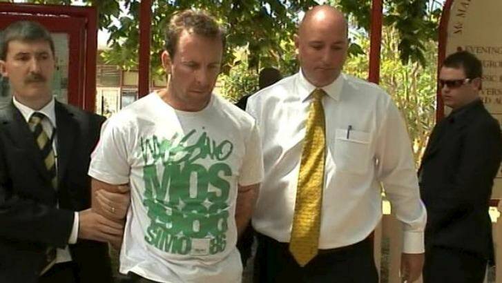 Sean Waygood is led away after his dramatic arrest at a cafe on Sydney's north shore in January 2009. Photo: Police Media