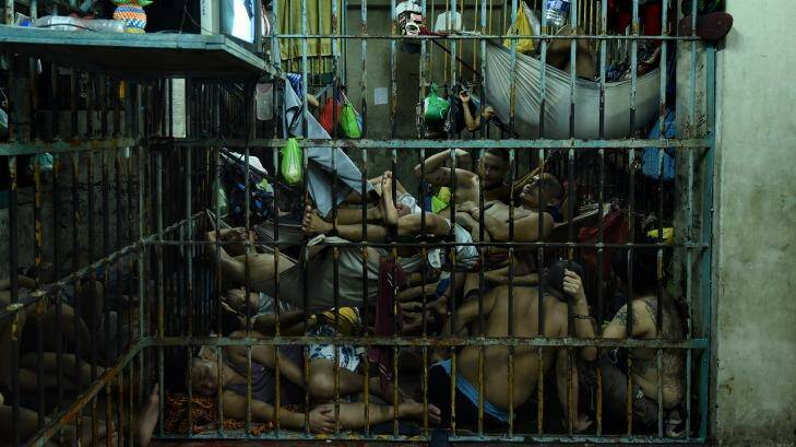 Prisoners in a crowded cell at Manila police headquarters. Photo: Kate Geraghty