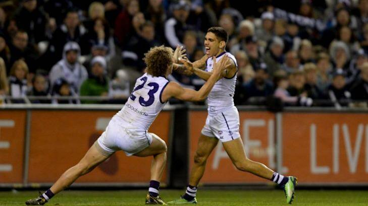Not celebrating: Dockers Chris Mayne and Michael Walters are both struggling with ankle injuries Photo: Pat Scala