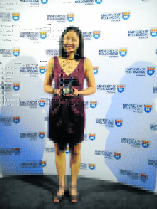 COMMITTED: Dr Teena Downton, who lives and works in Tamworth, with her University of Wollongong award.