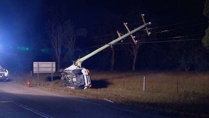 The force of the crash snapped the power pole in half.  Photo: Carey Harris