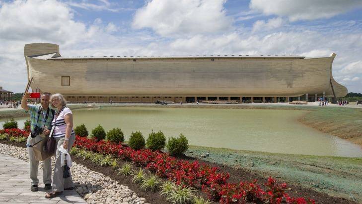 There's no age limit for selfies: Visitors take a selfie as a replica Noah's Ark stands in the distance at the Ark Encounter theme park in Williamstown, US. Photo: John Minchillo