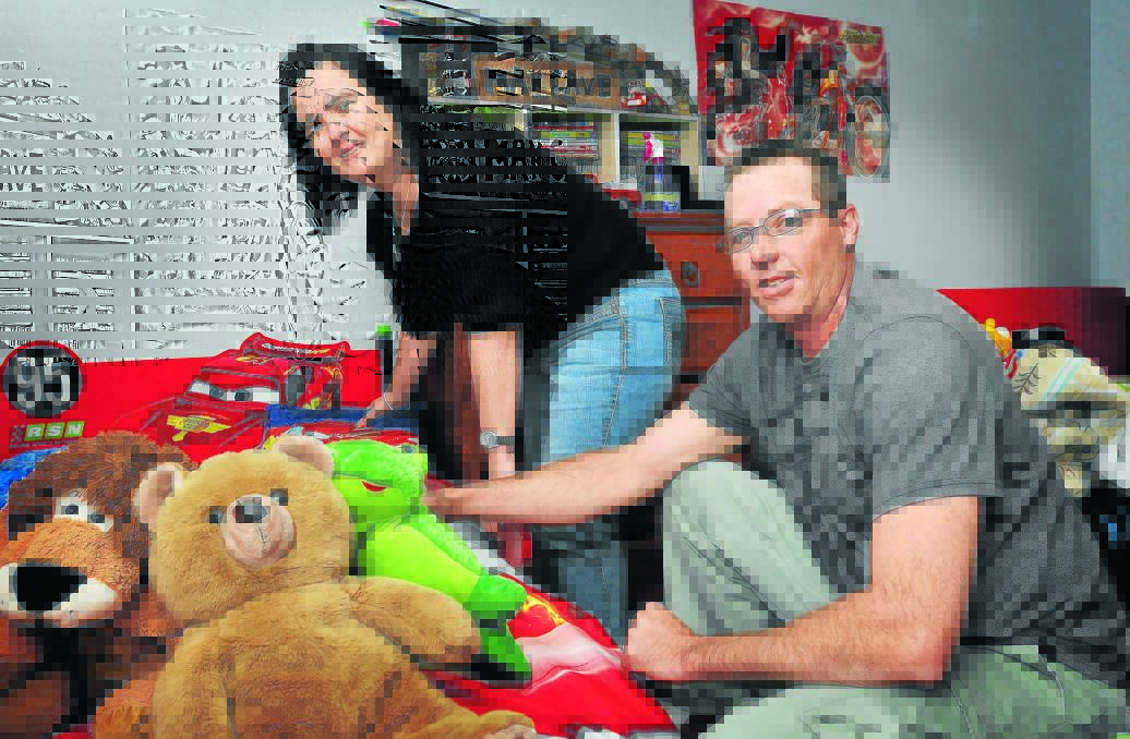 COMPASSIONATE KIND: Tamworth couple Kerry and Rob have been fostering children in need for the past six years. Photo: Geoff O Neill 180914GOC01