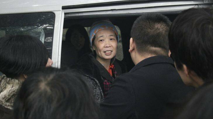 Hard times: Charlotte Chou requested a beanie for her release as her hair had turned almost completely grey during her years in prison. Photo: Sanghee Liu