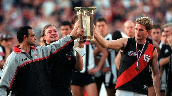 Respect: Michael Long, Kevin Sheedy and James Hird with the Anzac Trophy. Photo: Vince Caligiuri