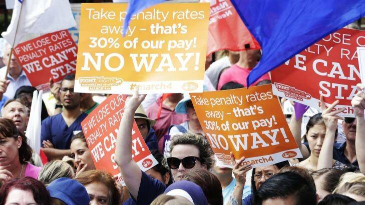 Thousands of workers vented their anger over cuts to penalty rates outside the NSW Parliament on Wednesday. Photo: Jessica Hromas
