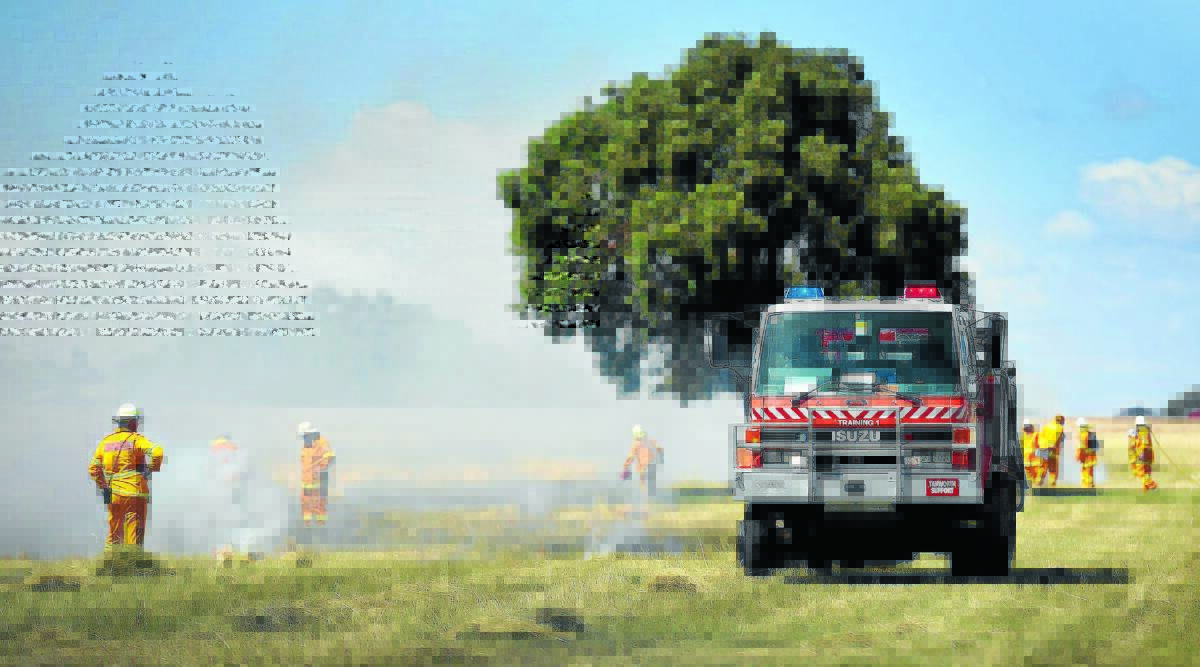 LIGHTING UP: RFS firefighters will undertake experimental burns, like this one near Moore Creek yesterday, in the name of research. Photo: Gareth Gardner 040315GGA01
