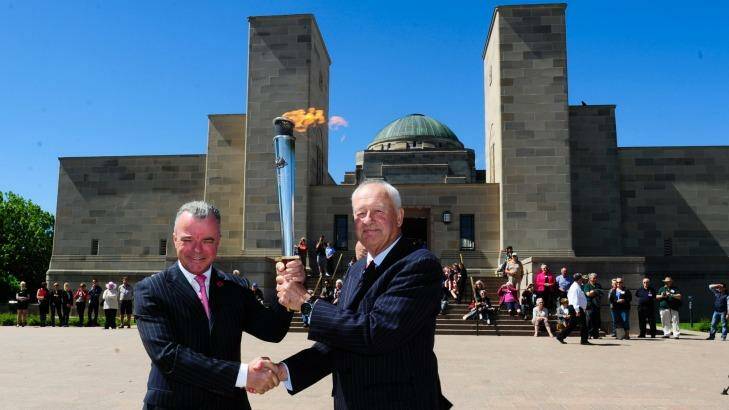 Dr Brendan Nelson Director of the Australian War Memorial and Alan Ferguson Chairman of Camp Gallipoli holding the RSL Anzac Flame. Photo: Melissa Adams