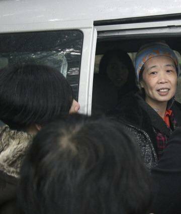 Hard times: Charlotte Chou requested a beanie for her release as her hair had turned almost completely grey during her years in prison. Photo: Sanghee Liu