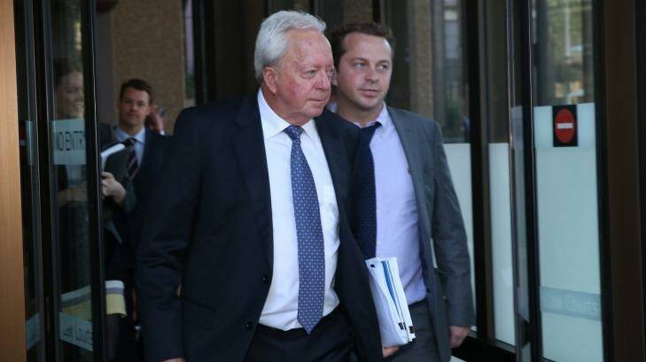John McGuigan and his son James leave the Federal Court in Sydney. Photo: Louise Kennerley