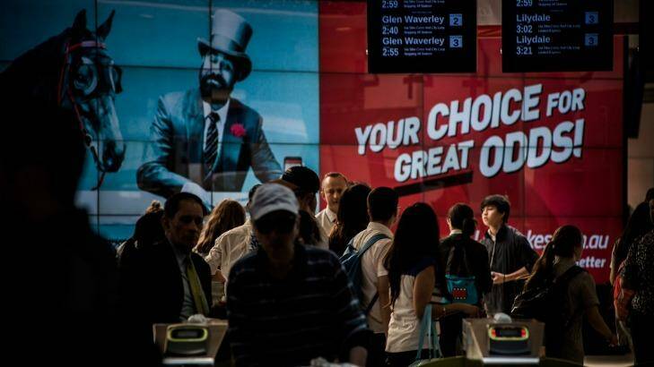 Ladbrokes bookmaker and online sports betting agency advertising dominating Flinders Street Station on October 14, 2015 in Melbourne. Photo by Josh Robenstone/Fairfax Media)