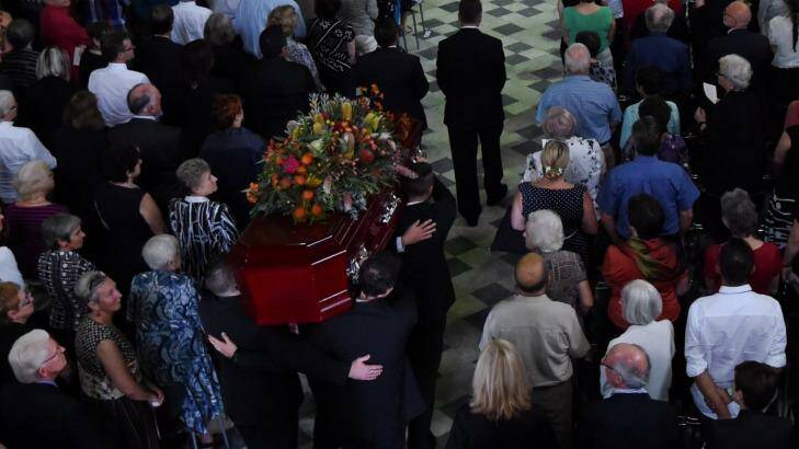 The casket of Faith Bandler arrives in The Great Hall at Sydney University. Photo: Dean Lewins