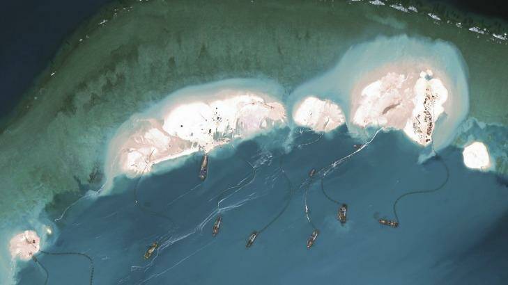 Chinese dredgers working in March at the northernmost reclamation site of Mischief Reef, part of the Spratly Islands, in the South China Sea.  Photo: CSIS