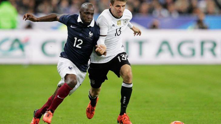 French footballer Lassana Diarra competes with German opponent Thomas Mueller during the match. Photo: Adam Pretty