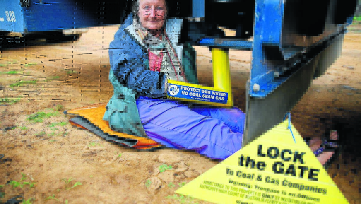 NOT FINE: Protesters who lock on to equipment - as Armidale environmental activist Pat Schultz did in the Pilliga State Forest in this 2014 file photo, face fines bigger than those for companies who damage the environment.