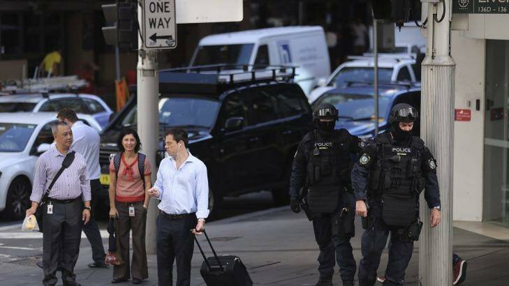 Public order and riot squad police outside officers opposite the Downing Centre courts on Liverpool street in Sydney. Photo: Kate Geraghty