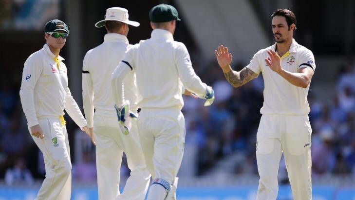 Striker: Australia's Mitchell Johnson celebrates the wicket of England's Moeen Ali. Photo: Paul Childs