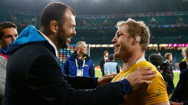 Home away from home: Michael Cheika and David Pocock embrace after the Wallabies beat Argentina at Twickenham.
 Photo: Getty Images 