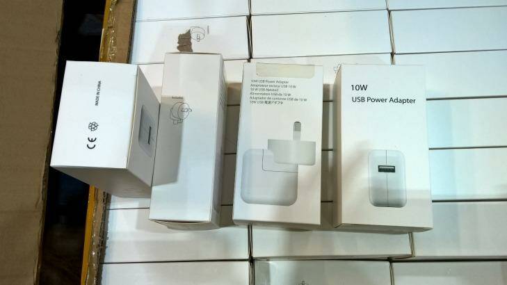 Some of the seized charger packaging, which was styled on branded products. Photo: NSW Fair Trading