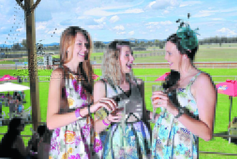 PARTY ROLLS ON: Soaking up the post-Christmas buzz at Quirindi Races yesterday are Kara Smith, Kirstan Smith and Emma Smith. Photo: Gareth Gardner 261214GGD02