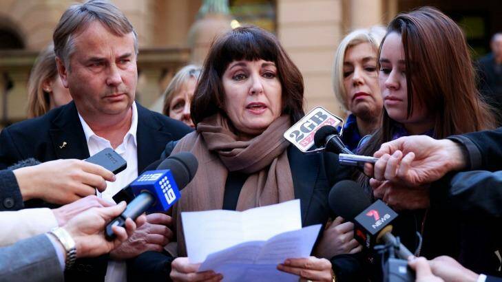 Members of the Kelly family, Ralph, Kathy and Madeleine, face the media outside court in 2013. Photo: Edwina Pickles